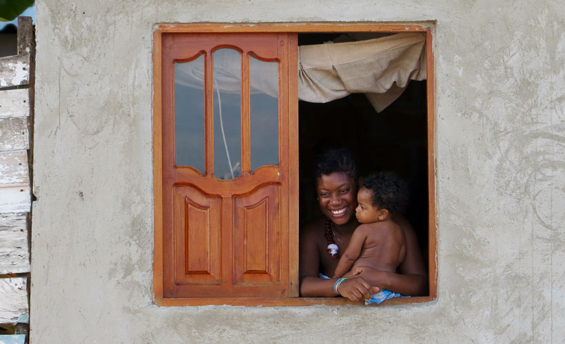 Local Cartagena lady with her baby at window