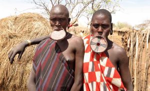 Mursi women showing clay plates in their lips